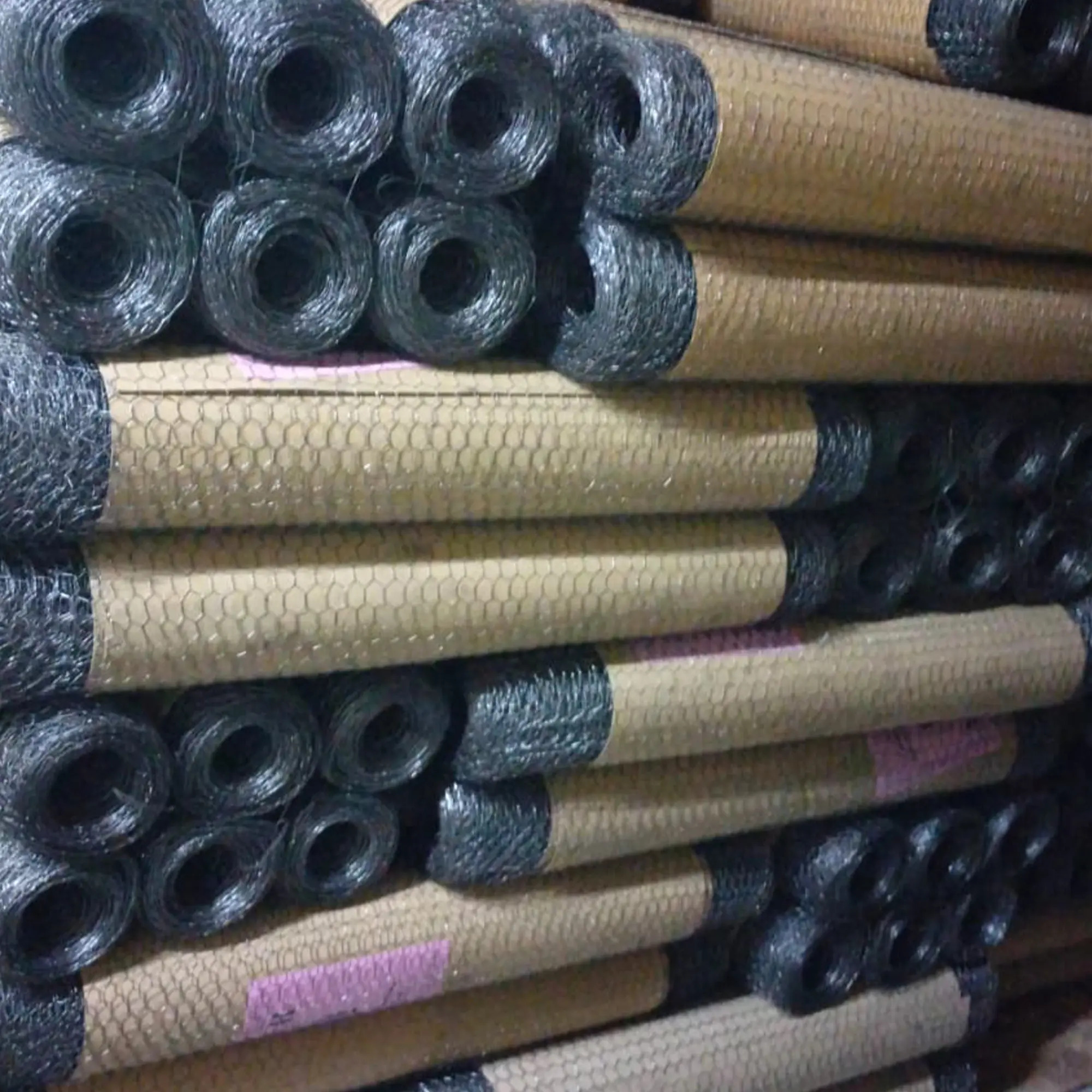 Galvanized iron chicken wire mesh rolls in 1/2 inch and 3/4 inch aperture stacked in stock
