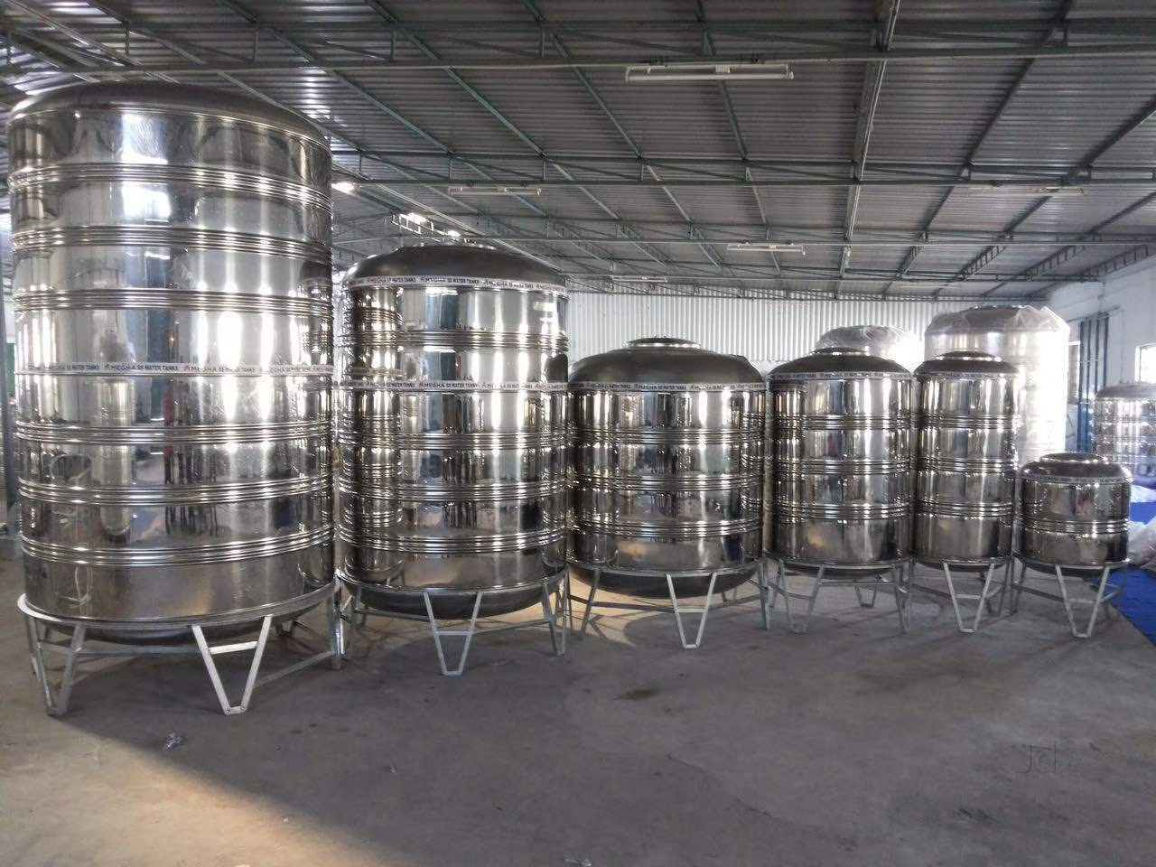 1000L and 2000L 3-layer water storage tanks installed on a building terrace